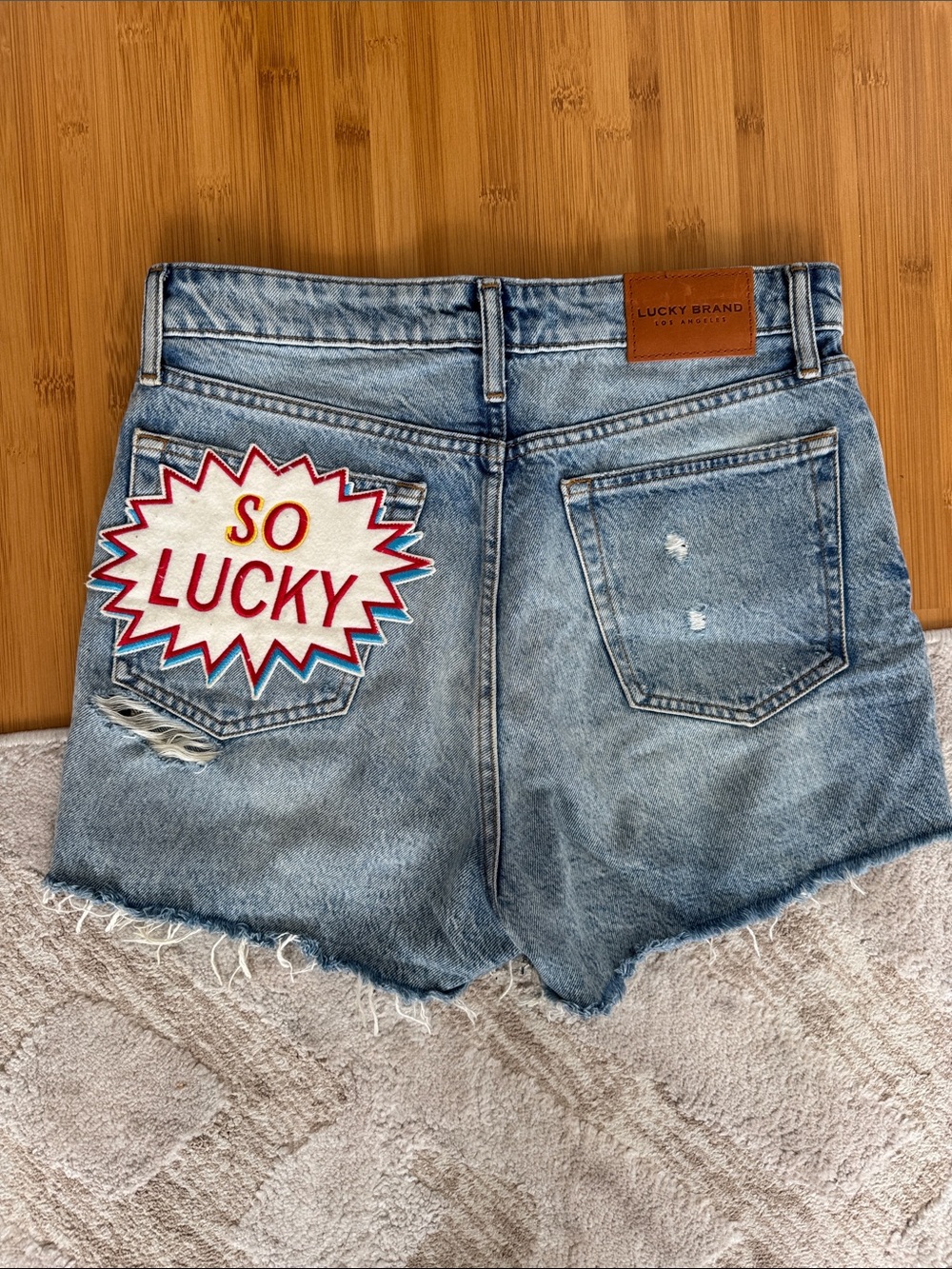 Lucky Brand Light Blue Denim Cutoff Shorts with 'So Lucky' Patch